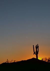 Silhouette people standing against sky during sunset