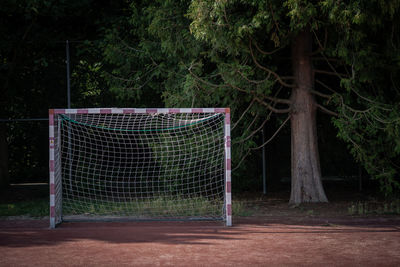 Goal post against trees