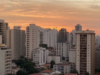 High angle view of buildings against sky during sunset