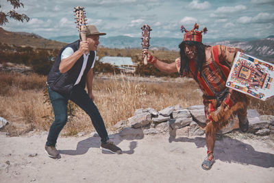 Representation of inca warrior dressed and with battle, prehispanic fighting with a tourist in peru