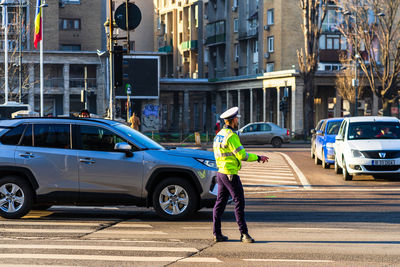 Man working on street in city