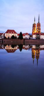 Reflection of illuminated buildings in lake