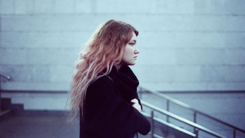 Portrait of a woman standing at the subway station