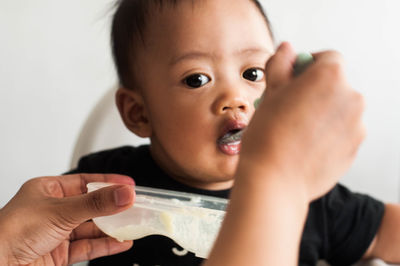 Portrait of cute boy eating food