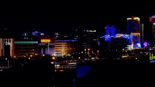 Illuminated cityscape at night