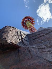 Low angle view of rock against sky