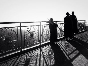 Silhouette of woman against clear sky