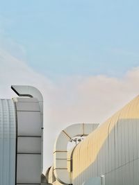 Low angle view of factory against sky