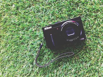 Close-up of camera on grass