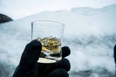 Close-up of hand holding drink