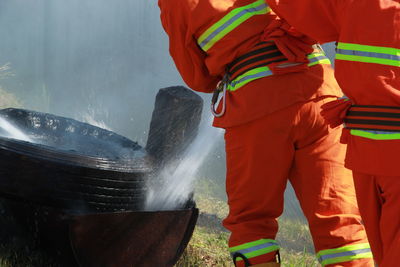 Rear view of men working