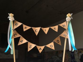 Low angle view of decoration hanging on wall