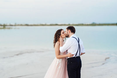 Couple standing on beach