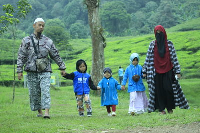 Group of people standing on field