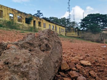 Close-up of rocks on field against sky