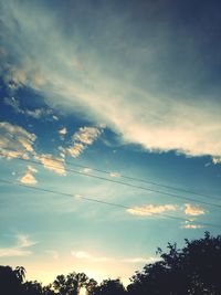 Low angle view of silhouette trees against sky during sunset