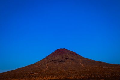 View of mountain against blue sky