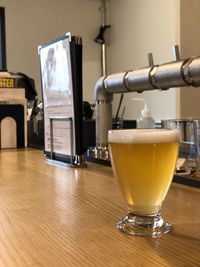 Close-up of beer in glass on table