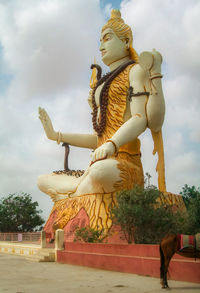 Low angle view of statue against sky