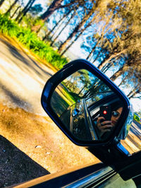 Reflection of car on side-view mirror