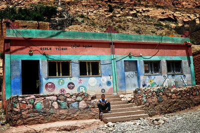 Woman standing against wall