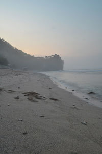 Scenic view of sea against clear sky during sunset