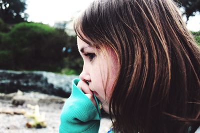 Close-up side view of young woman