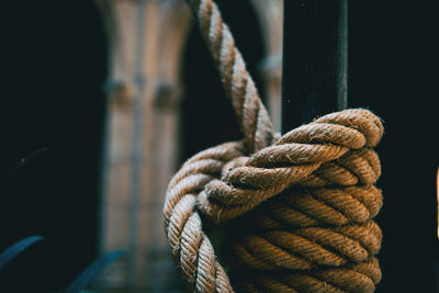 Close-up of rope tied to wooden post