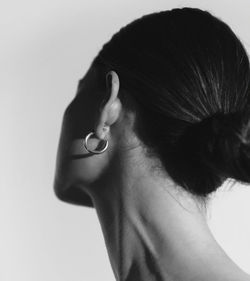 Side view of woman against white background