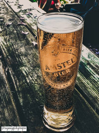 Close-up of beer glass on table