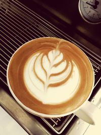 High angle view of cappuccino on table