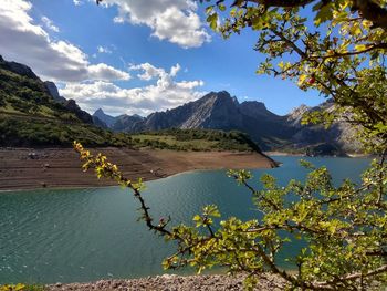 Scenic view of lake and mountains against sky