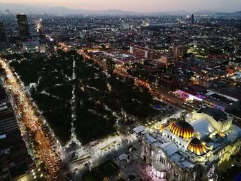 High angle view of illuminated buildings in city at night