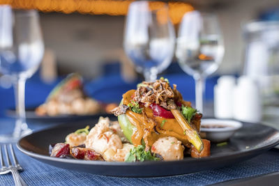 Close-up of delicious food served in plate on dining table at restaurant