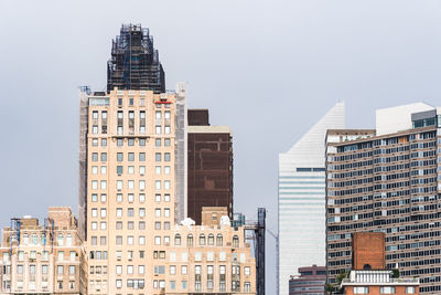 Low angle view of buildings against clear sky