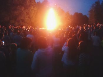 People enjoying concert at night