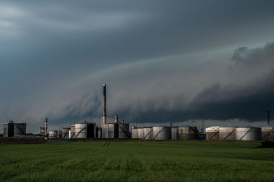 Storm clouds over crossbridge energy fredericia refinery, denmark