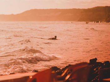 Scenic view of sea against sky during sunset