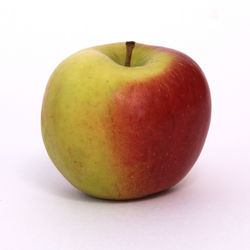 Close-up of apple against white background