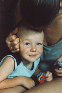 Portrait of cute boy smiling at home