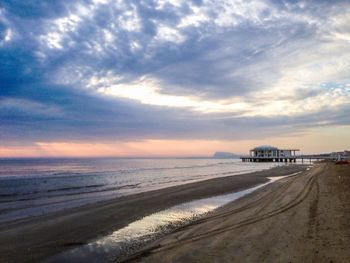 Scenic view of sea against cloudy sky