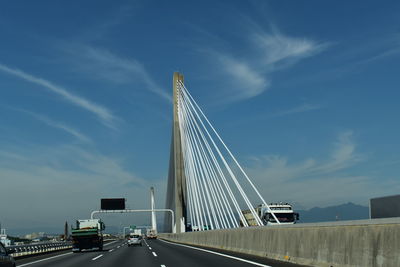 Low angle view of bridge against blue sky