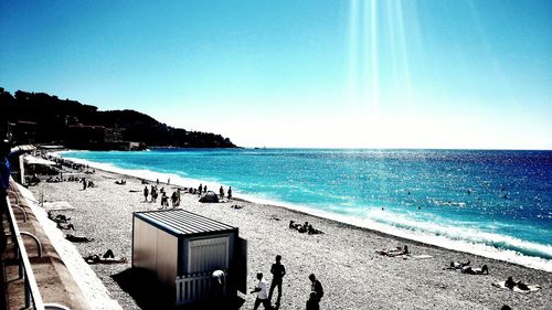 Scenic view of beach against blue sky