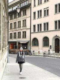 Full length of woman walking in city