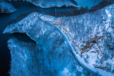 High angle view of road on snow covered landscape