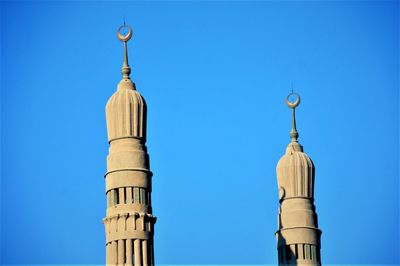 Low angle view of building against clear blue sky