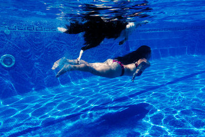 Man swimming in pool