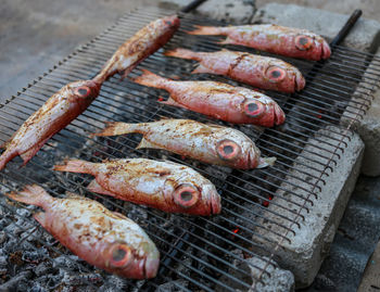 High angle view of meat on barbecue grill