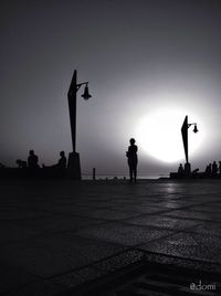 Low angle view of woman in mid-air against sky