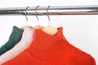 Close-up of clothes hanging over white background